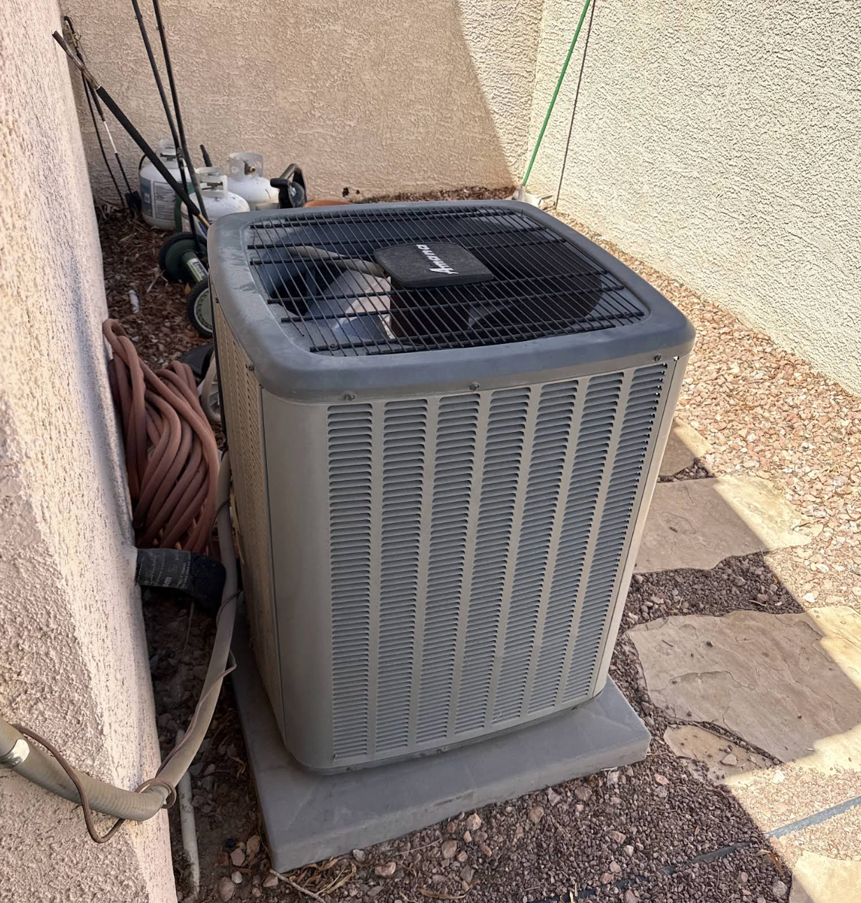 Noble Air HVAC technician servicing air conditioning unit in Phoenix Arizona